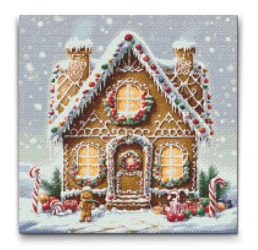 diamond painting af peberkagehus dækket af sne og slikdekorationer, ideel til jul