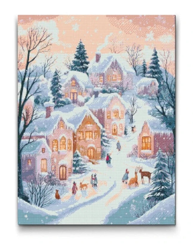 Diamond painting af en vinterlandsby med sne og varme lys i vinduerne, omgivet af grantræer og glade mennesker